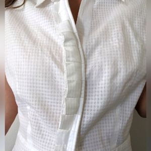 New White cap sleeves,  scallop design over the buttons. Tie waistband, Size L